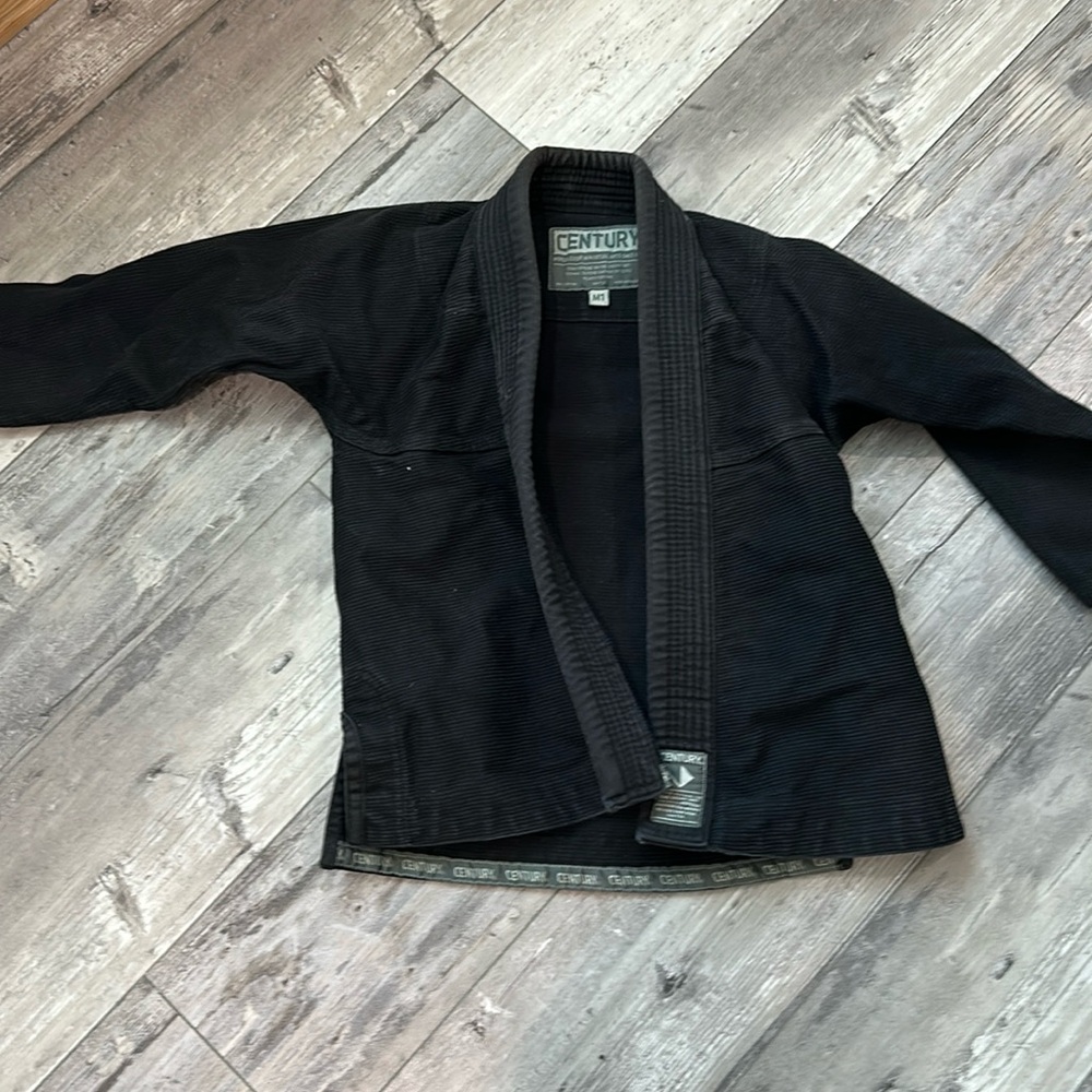 Century martial arts uniform size M1 lightly worn black. Top only.
